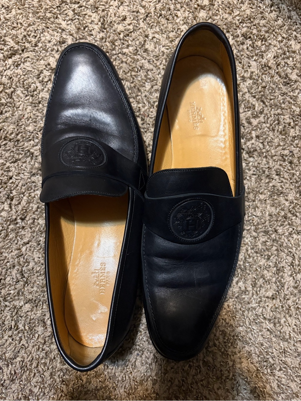 Hermes Black Leather Penny Loafers with Embossed Medallion